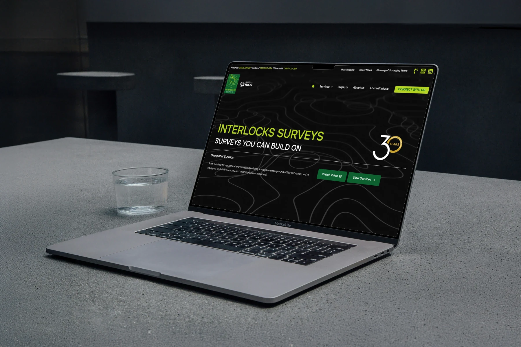 Interlock Surveys — MacBook on concrete