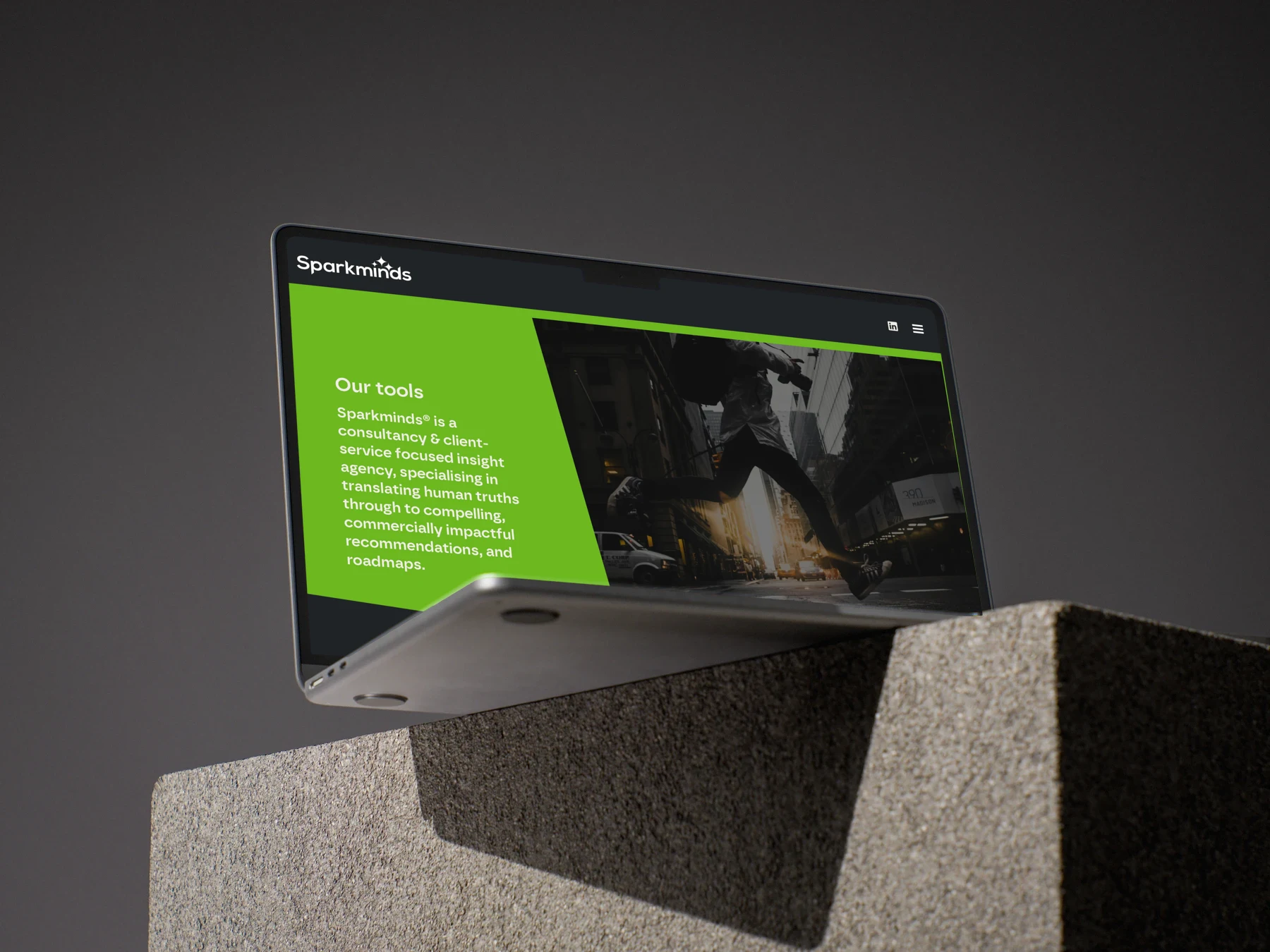 Sparkminds — MacBook on concrete blocks